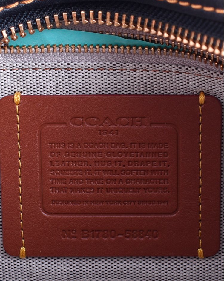 coach tea rose saddle bolsa